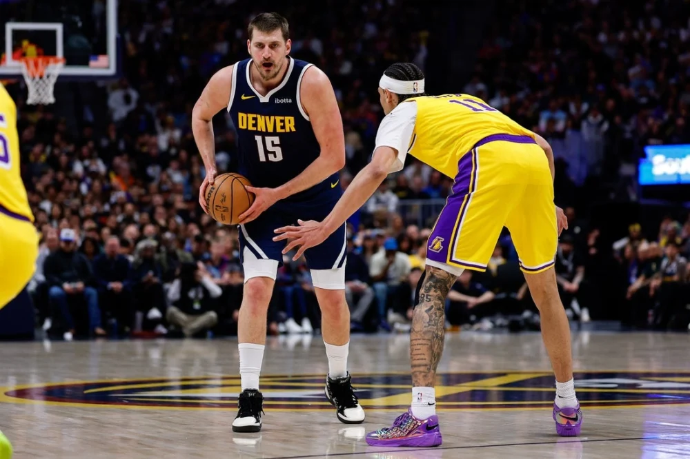 Denver Nuggets Outlast Los Angeles Lakers in Pivotal Western Conference Clash Amidst Milestones and Injuries