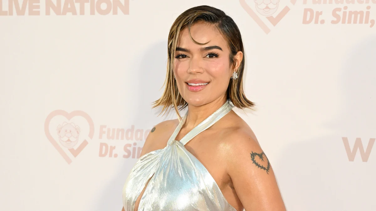 Karol G Dazzles in Liquid Silver Celia Kritharioti Gown at Con Cora Land Gala