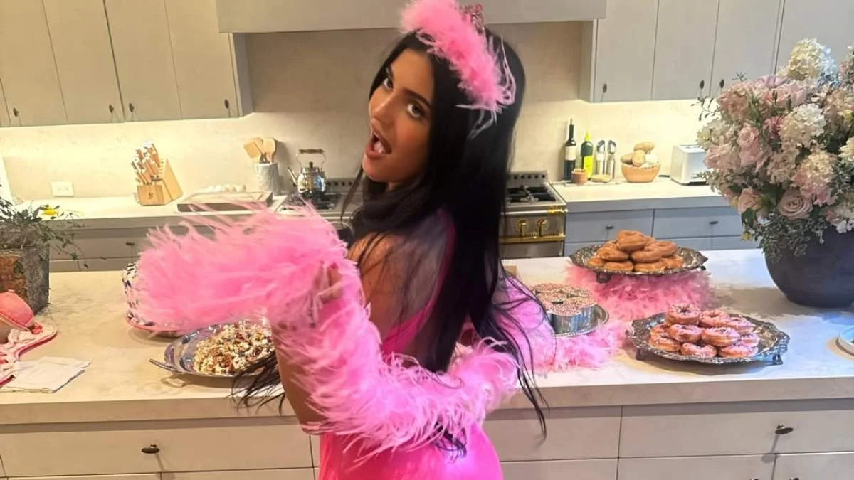 Kylie Jenner gives a peek at her lacy lingerie in teeny tiny Saint Laurent coat for Who What Wear